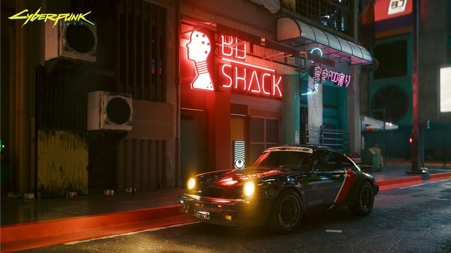A car sits on a neon-lit street in Cyberpunk 2077, showcasing its Overdrive Mode with path tracing.