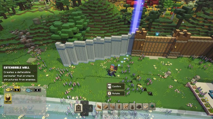 The player character in Minecraft Legends constructs a wall around a friendly village in a grassy plains biome.