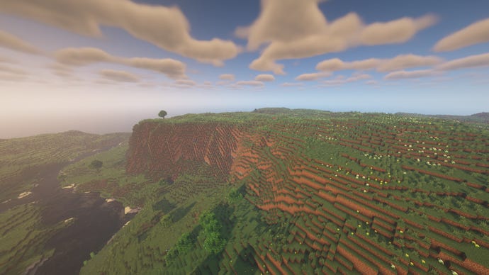 A Minecraft landscape of cliffs and plains, with a river on the left.