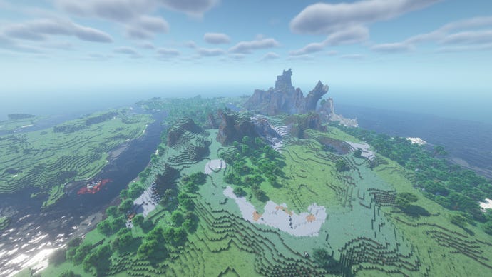 A vast Minecraft landscape of forests, hills, and rocky plains, with a coastal mountain range in the distance.