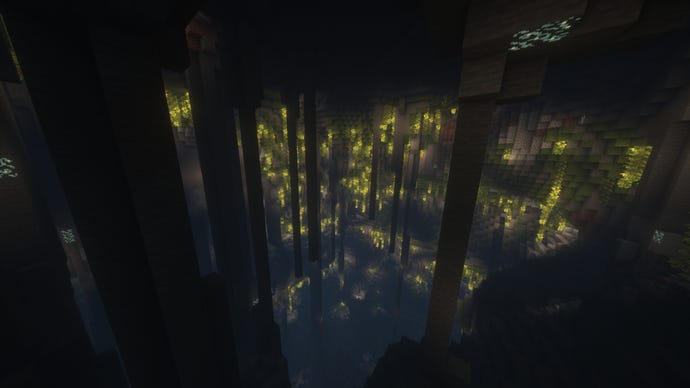The interior of a hollow mountain in Minecraft, filled with stalactites and Lush Caves flora.