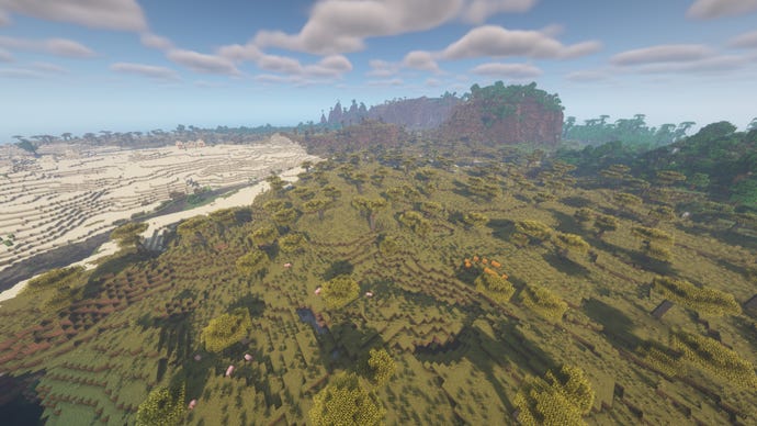 A Minecraft landscape with desert on the left, forest on the right, and mountains in the distance.
