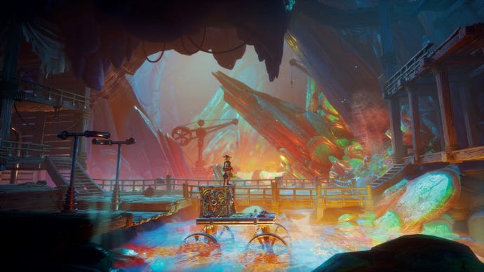 A wizard stands on top of a metal box in an underground mining scene in Trine 5: A Clockwork Conspiracy